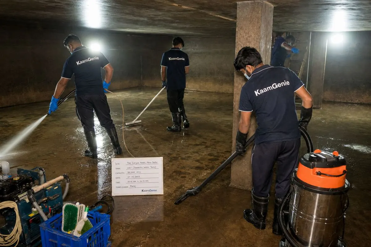 KaamGenie crew cleaning a large underground water reservoir at a Delhi hotel overnight while guests sleep