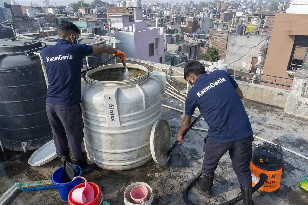 KaamGenie crew cleaning a water tank in Jaitpur, Delhi