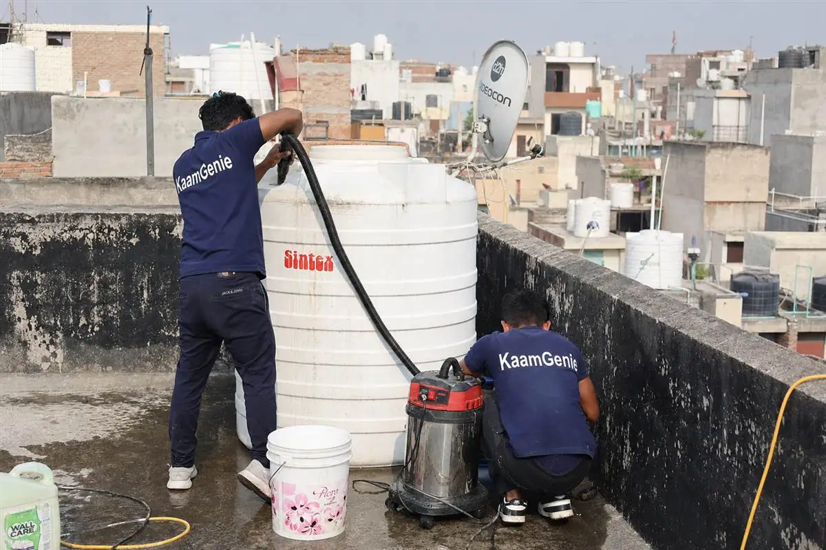 KaamGenie crew cleaning a water tank in Jharoda, Delhi