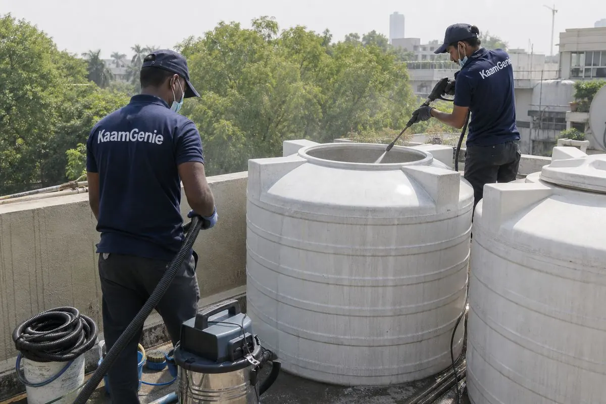 KaamGenie crew cleaning a water tank in Jor Bagh, Delhi