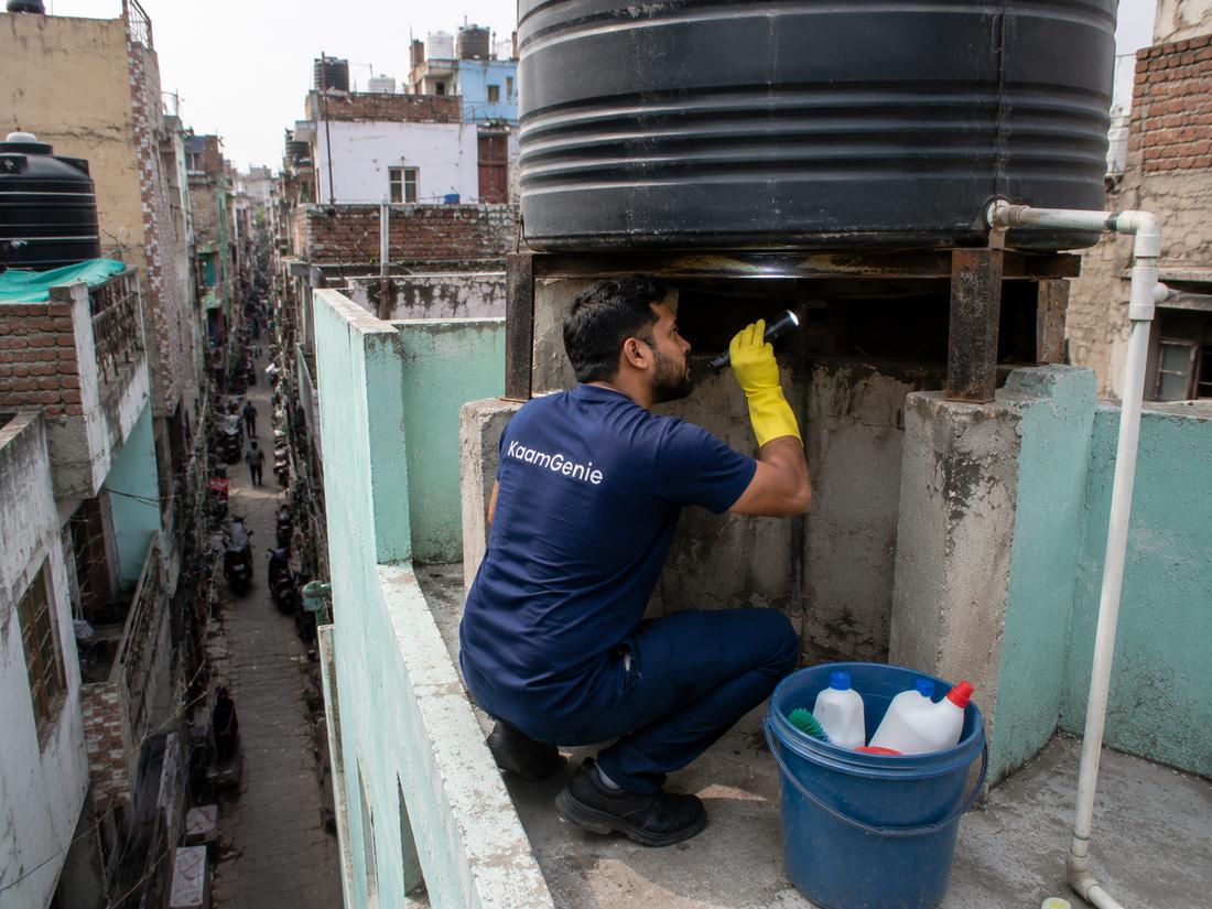 KaamGenie crew cleaning a water tank in Kailash Nagar, East Delhi