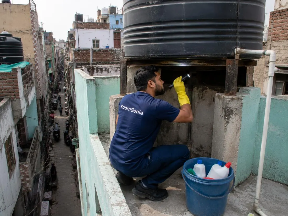 KaamGenie crew cleaning a water tank in Kailash Nagar, East Delhi