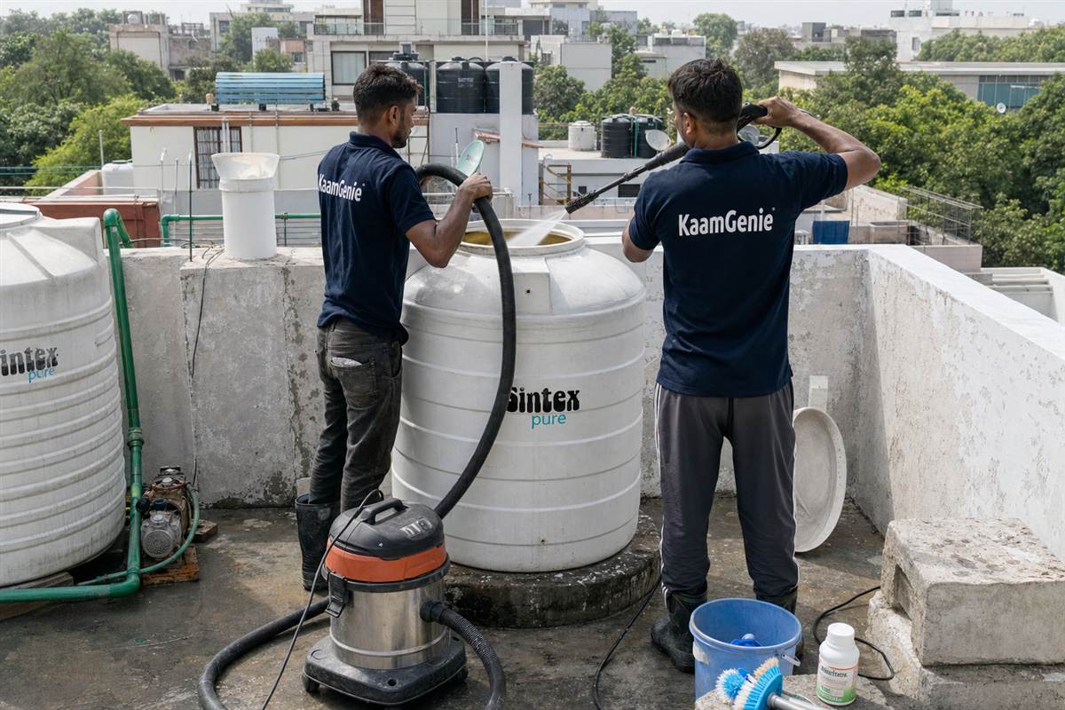 KaamGenie crew cleaning a water tank in Khirki Extension, Delhi