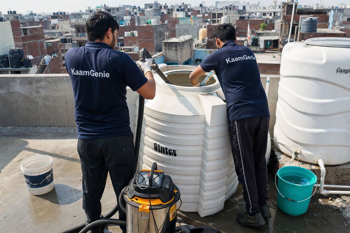 KaamGenie crew cleaning a water tank in Kondli, Delhi