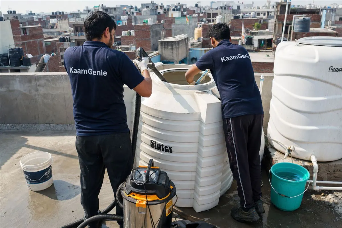 KaamGenie crew cleaning a water tank in Kondli, Delhi