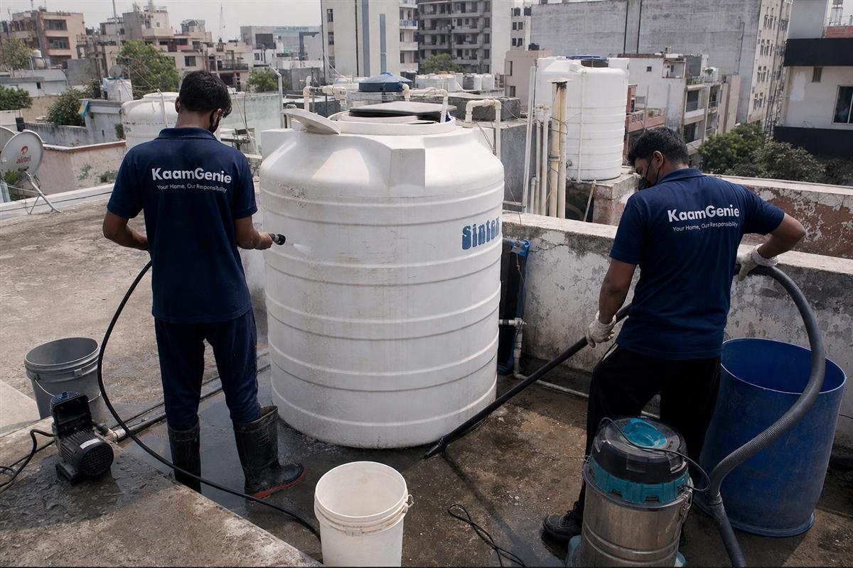 KaamGenie crew cleaning a water tank in Mayur Vihar Phase 2, Delhi