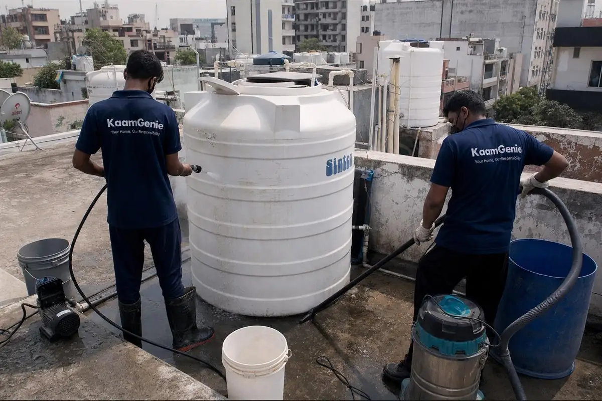 KaamGenie crew cleaning a water tank in Mayur Vihar Phase 2, Delhi