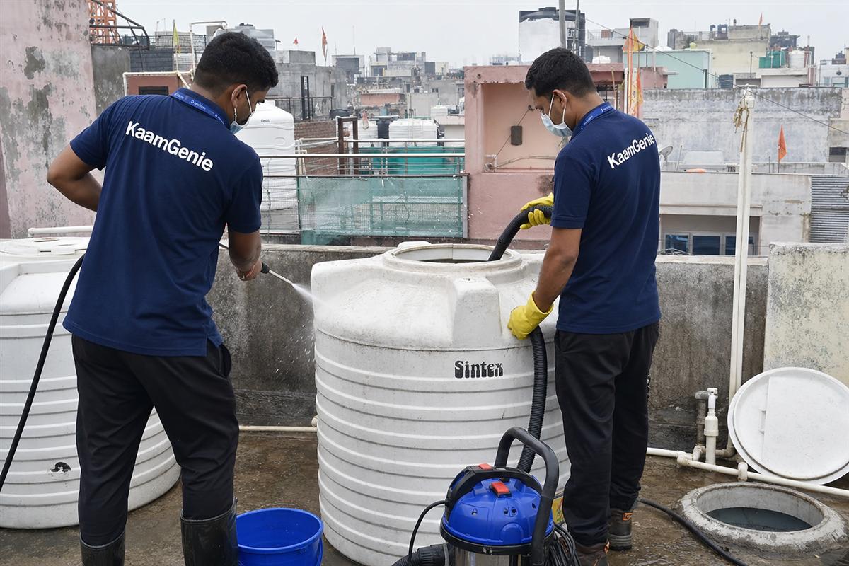 KaamGenie crew cleaning a water tank in Meethapur, Delhi
