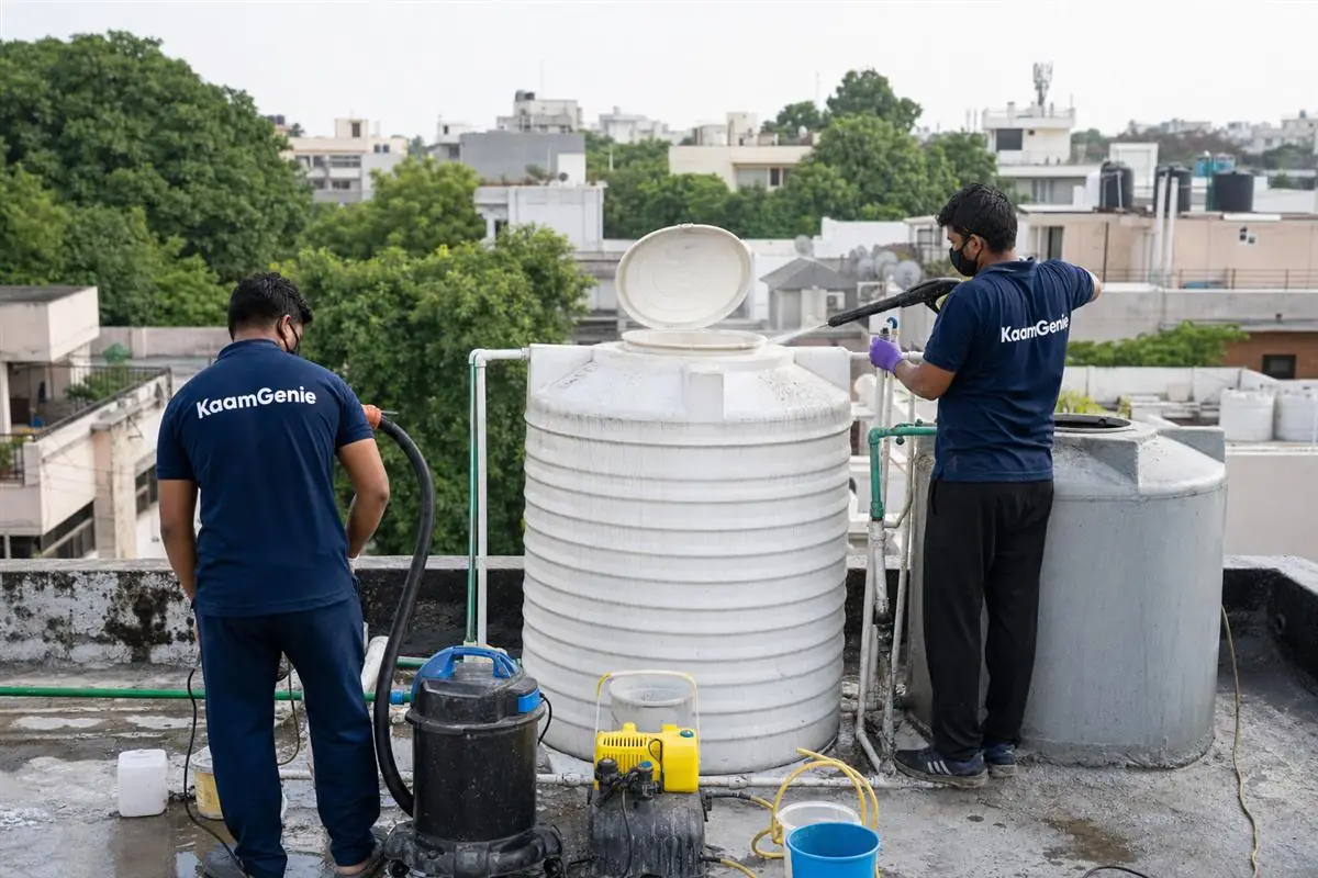 KaamGenie crew cleaning a water tank in Moti Bagh, Delhi
