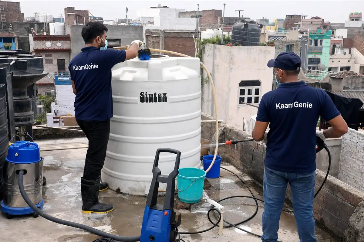 KaamGenie crew cleaning a water tank in Mukundpur, Delhi