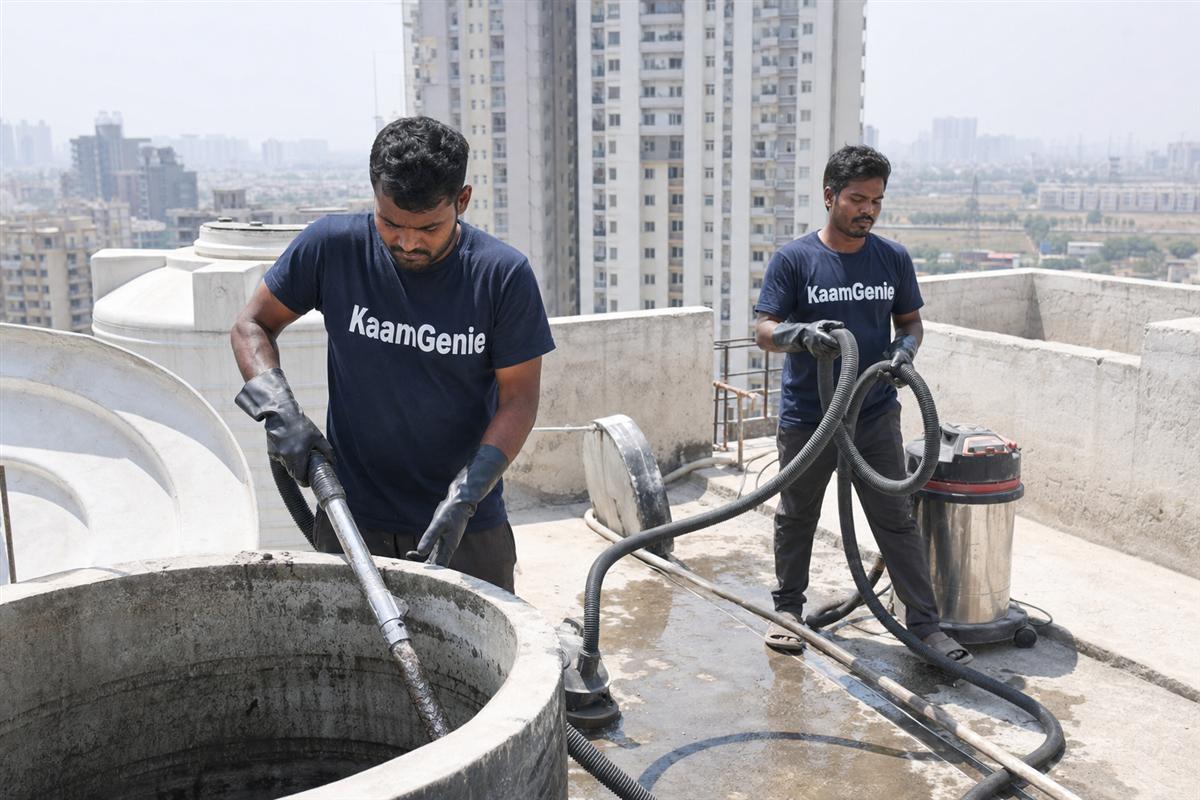 KaamGenie crew cleaning a water tank in Bisrakh, Noida