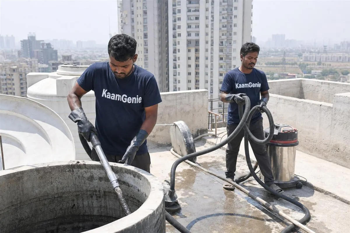 KaamGenie crew cleaning a water tank in Bisrakh, Noida