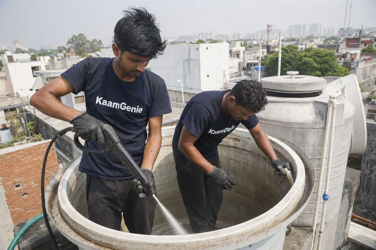 KaamGenie crew cleaning a water tank in Hoshiarpur, Noida