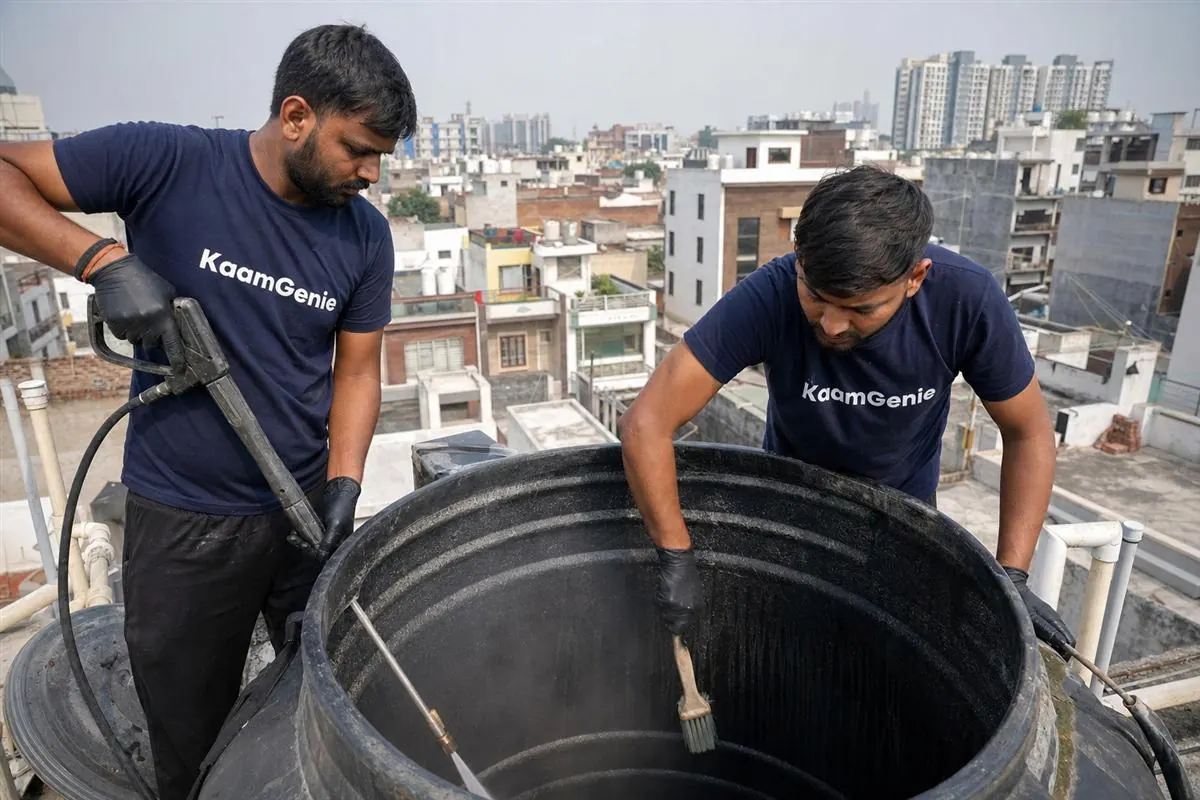 KaamGenie crew cleaning a water tank in Salarpur, Noida