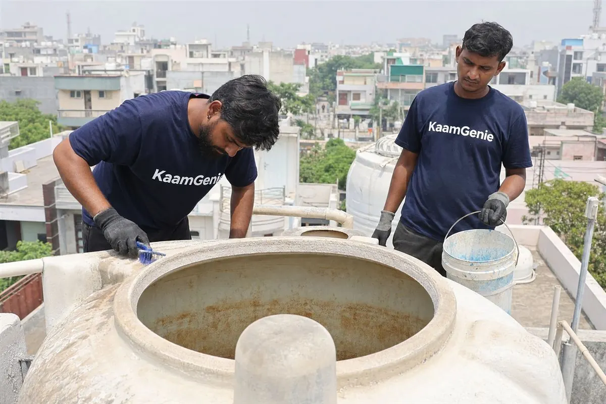 KaamGenie crew cleaning a water tank in Sector 102, Noida