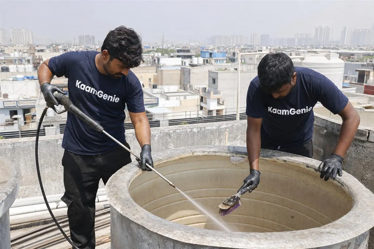 KaamGenie crew cleaning a water tank in Sector 115, Noida