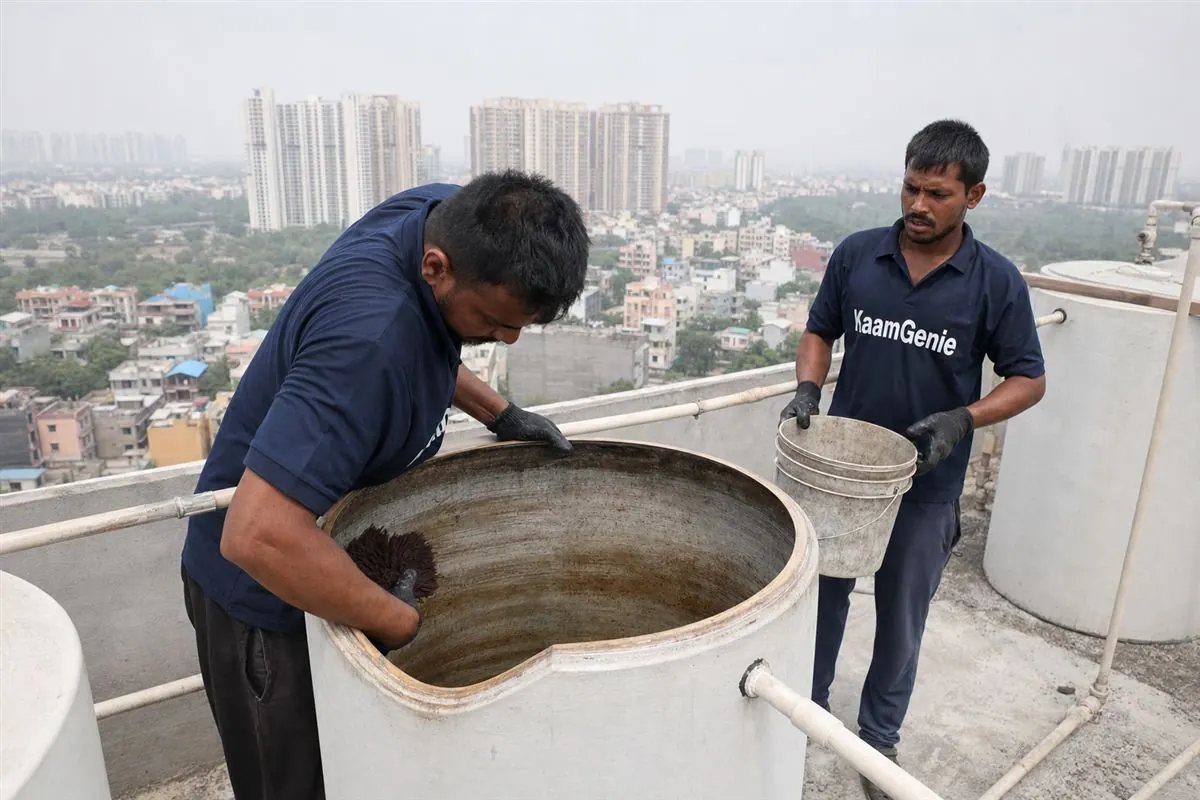 KaamGenie crew cleaning a water tank in Sector 120, Noida