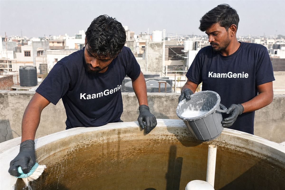 KaamGenie crew cleaning a water tank in Sector 123, Noida