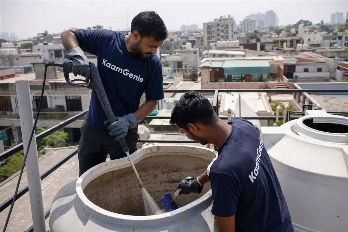 KaamGenie crew cleaning a water tank in Sector 15, Noida