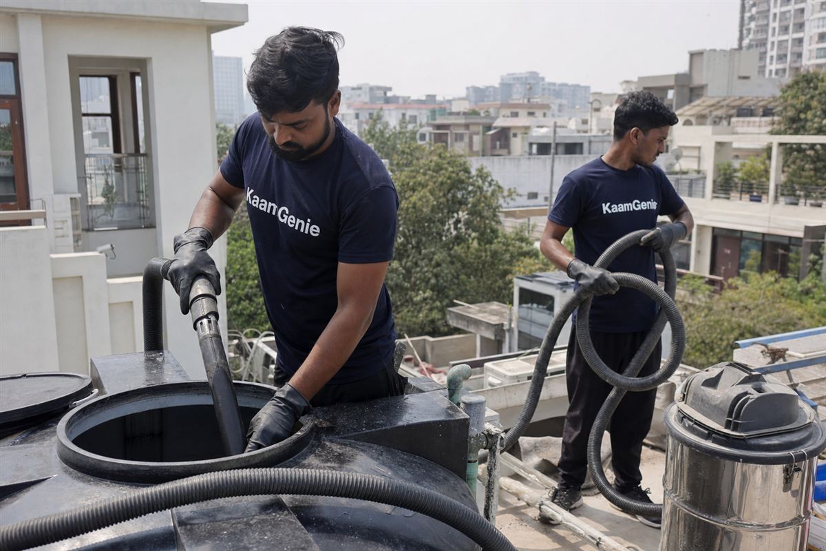 KaamGenie crew cleaning a water tank in Sector 20, Noida
