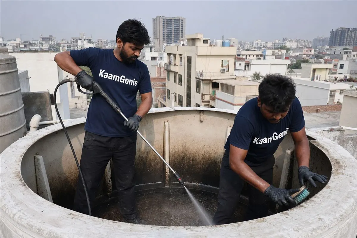 KaamGenie crew cleaning a water tank in Sector 30, Noida