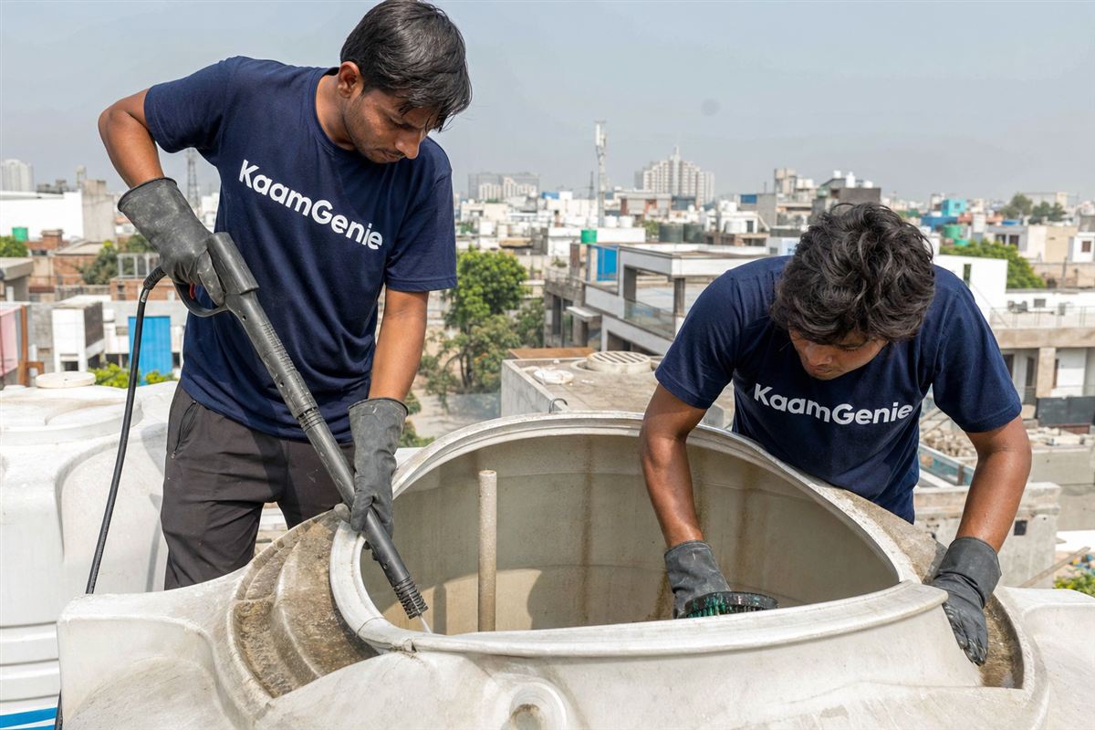 KaamGenie crew cleaning a water tank in Sector 42, Noida