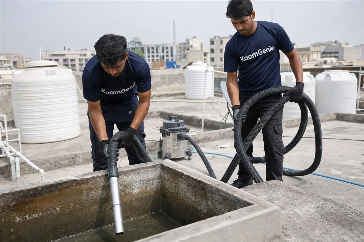 KaamGenie crew cleaning a water tank in Sector 44, Noida