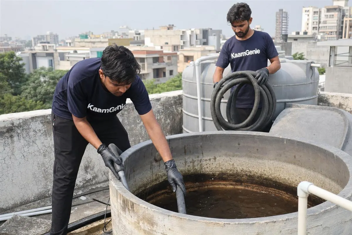 KaamGenie crew cleaning a water tank in Sector 54, Noida