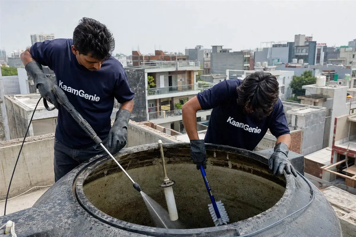KaamGenie crew cleaning a water tank in Sector 66, Noida