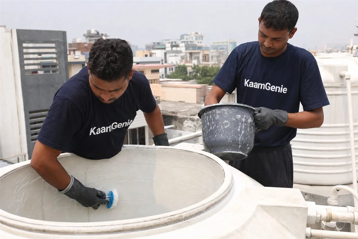 KaamGenie crew cleaning a water tank in Sector 72, Noida