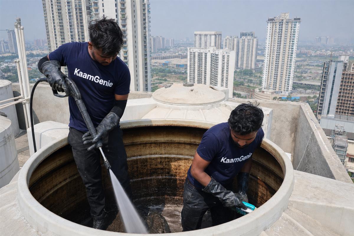 KaamGenie crew cleaning a water tank in Sector 74, Noida