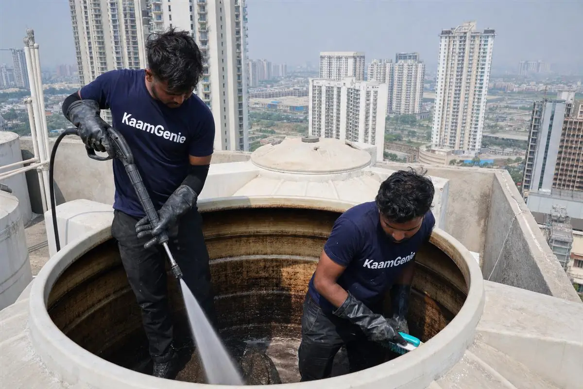 KaamGenie crew cleaning a water tank in Sector 74, Noida