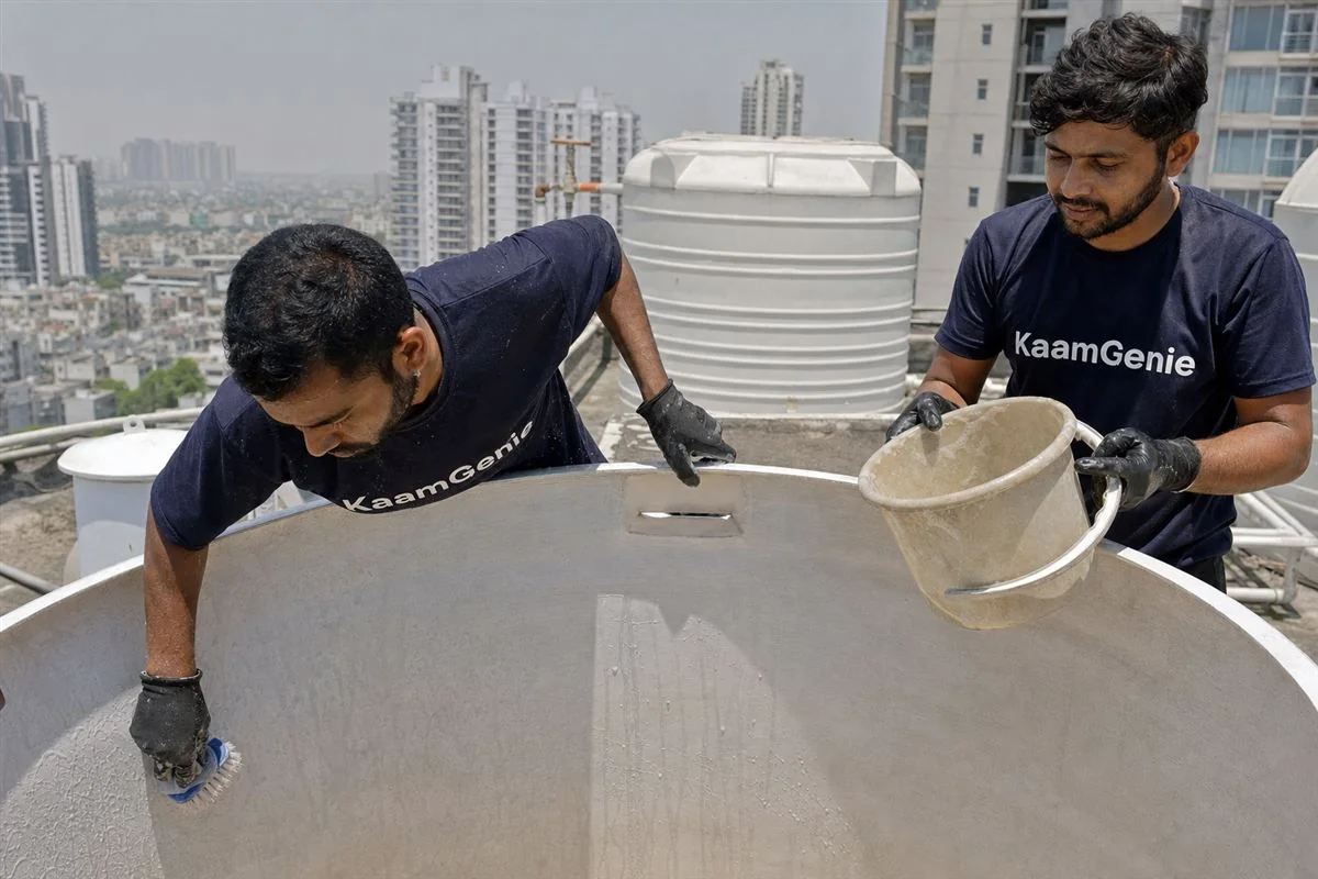 KaamGenie crew cleaning a water tank in Sector 77, Noida