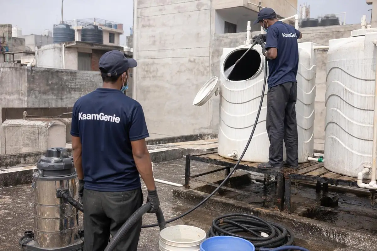 KaamGenie crew cleaning a water tank in Noor Nagar, Delhi