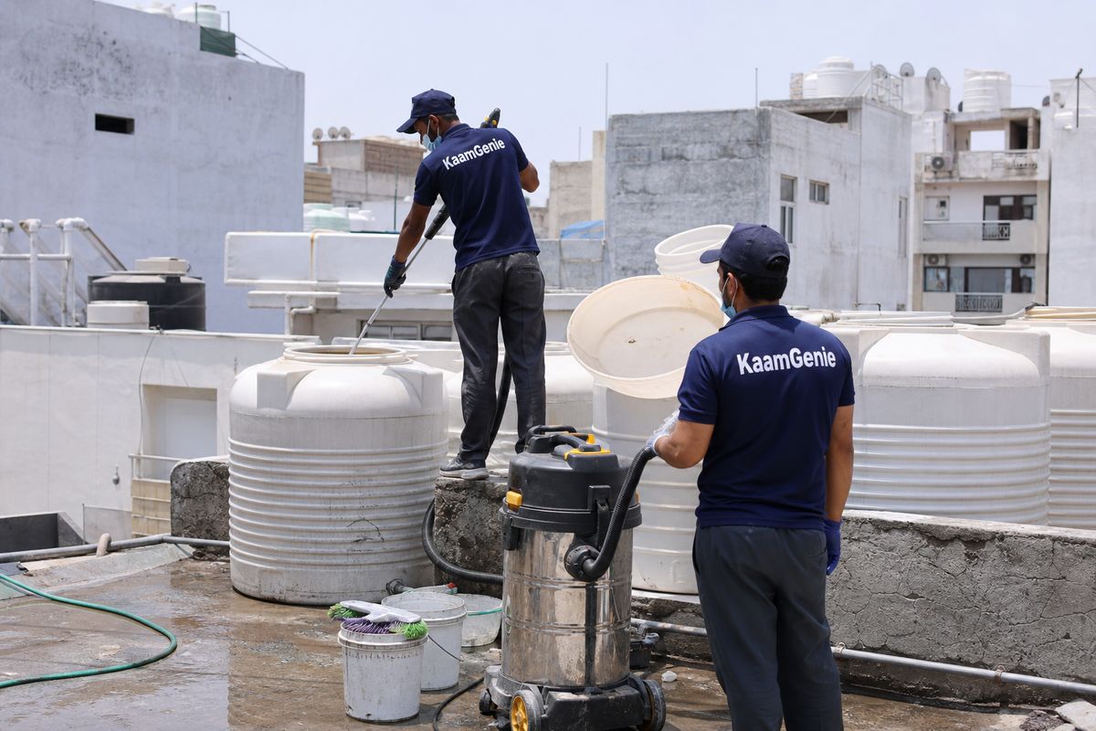 KaamGenie crew cleaning a water tank in Okhla Vihar, Delhi