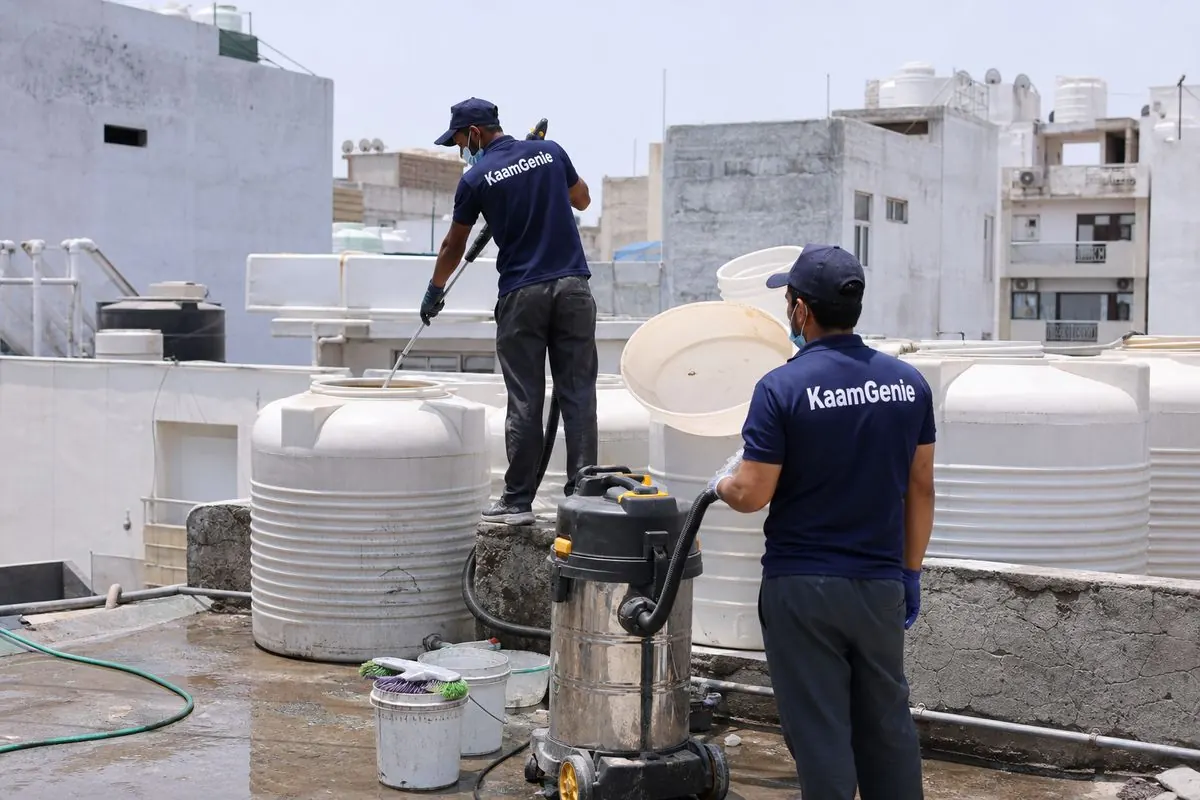 KaamGenie crew cleaning a water tank in Okhla Vihar, Delhi