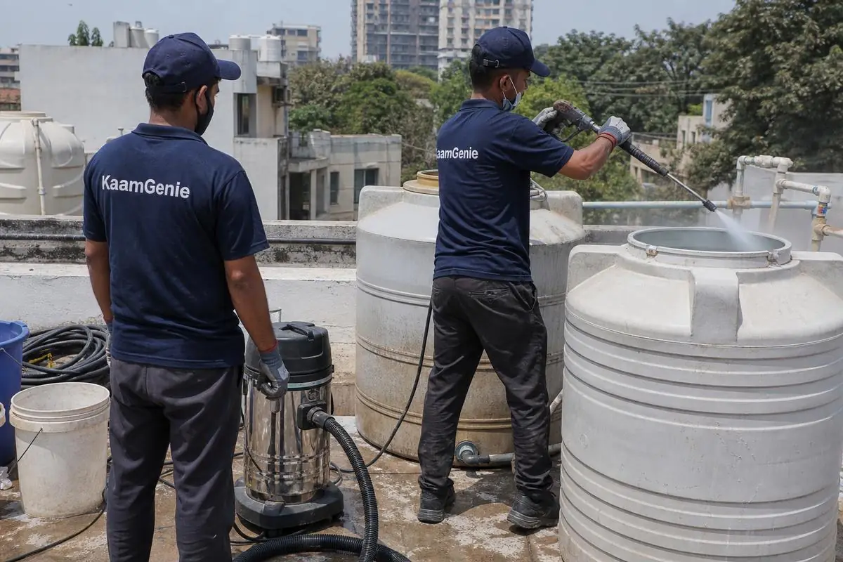 KaamGenie crew cleaning a water tank in Pamposh Enclave, Delhi