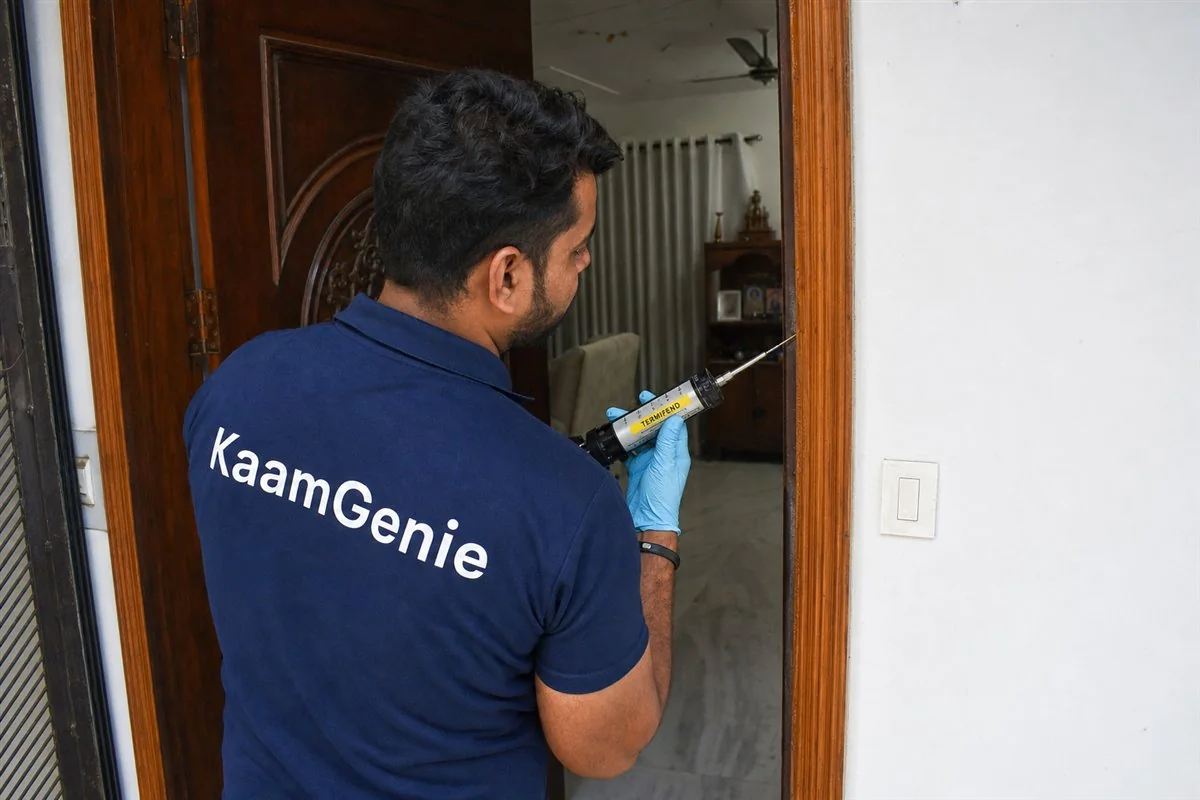 KaamGenie pest control technician treating a Adarsh Nagar property in North-West Delhi