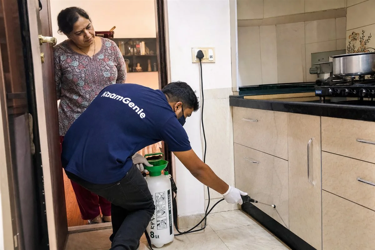 KaamGenie pest control technician treating a DDA flat in Alaknanda, South Delhi