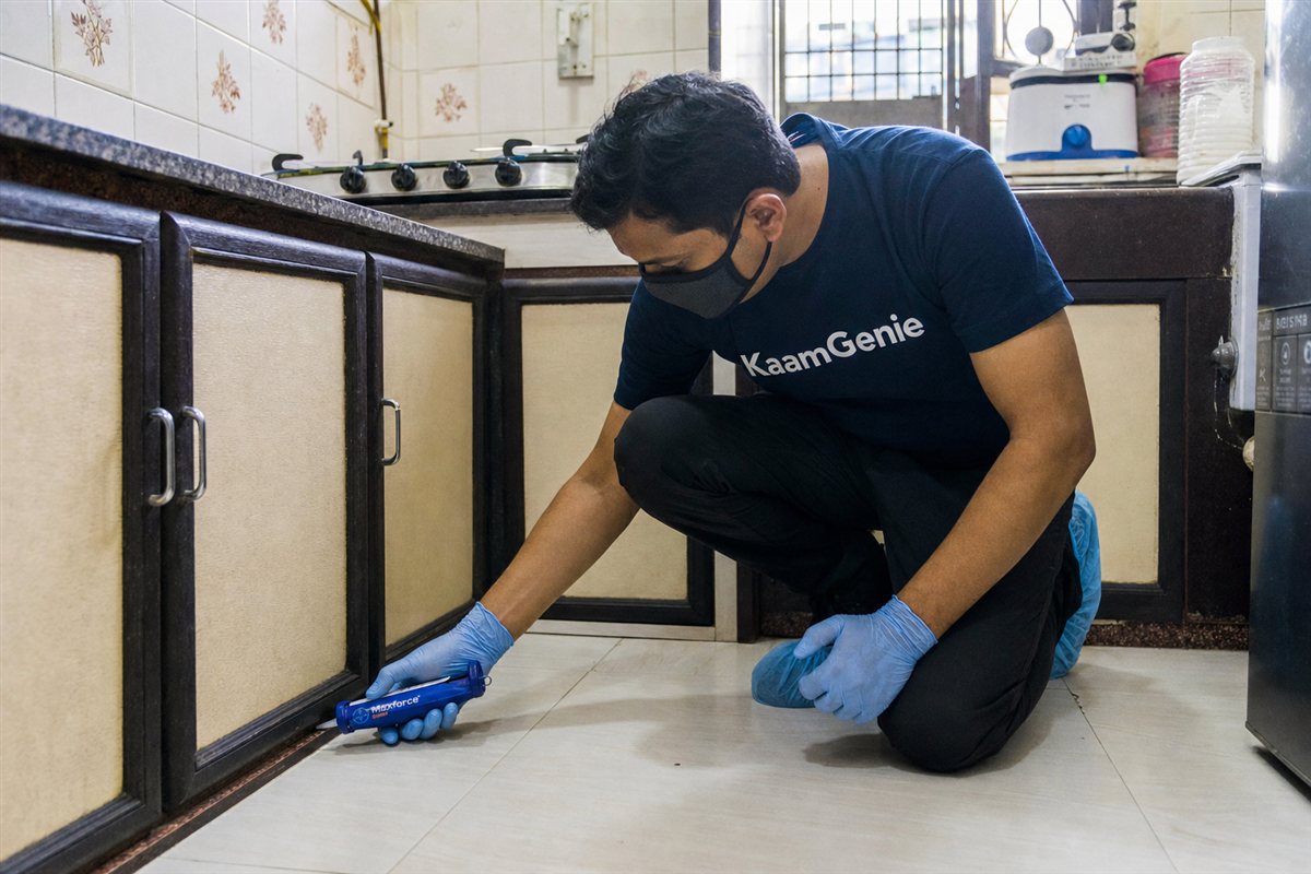 KaamGenie pest control technician treating a Anand Vihar property in East Delhi