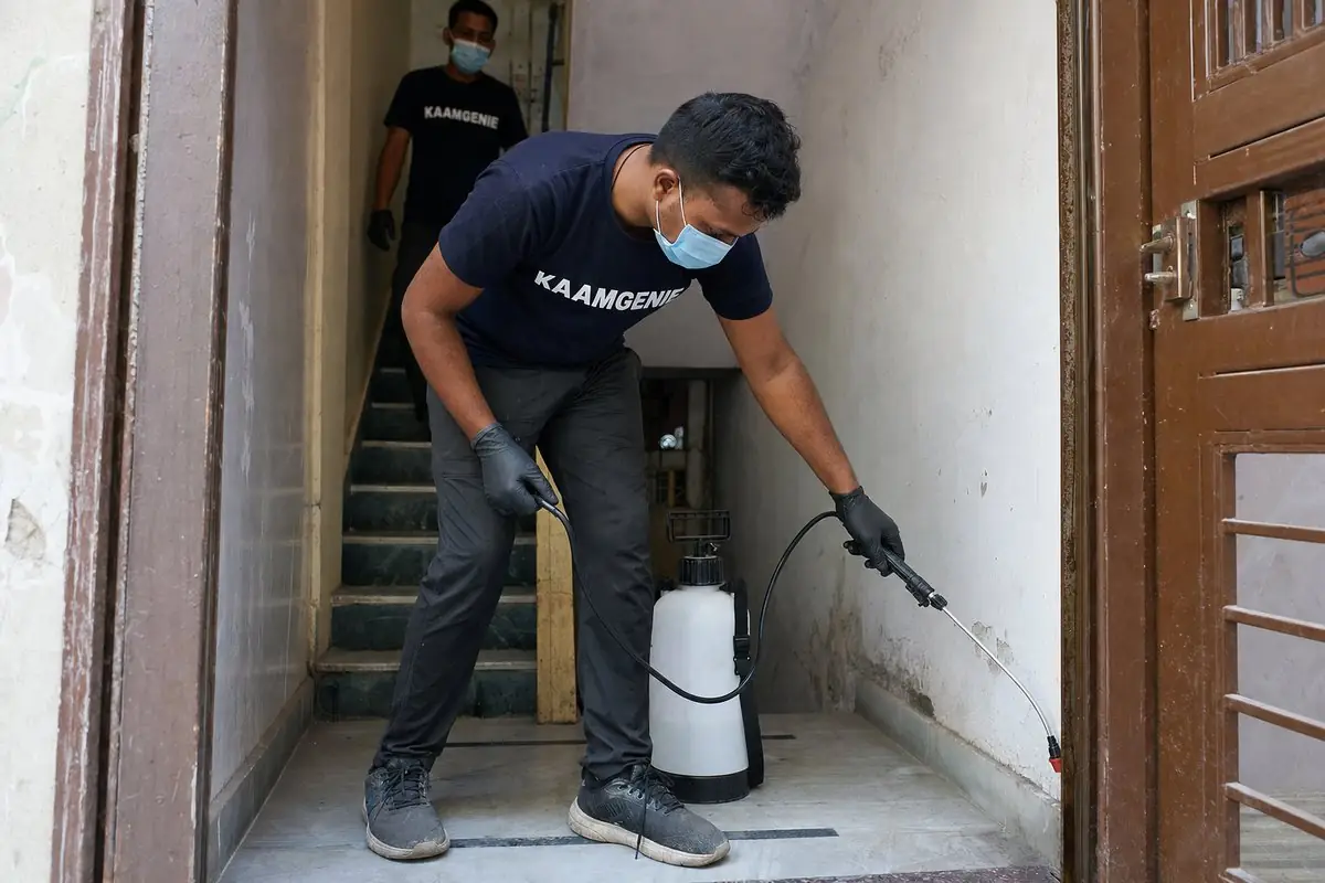 KaamGenie pest control technician treating a Arjun Nagar property in South Delhi
