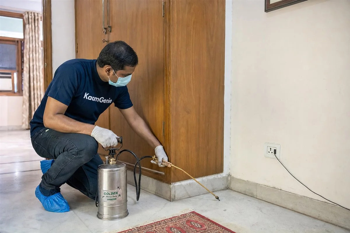 KaamGenie pest control technician treating a Ashok Vihar property in North-West Delhi