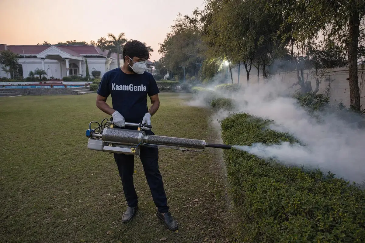 KaamGenie pest control technician treating a Bhati property in South Delhi