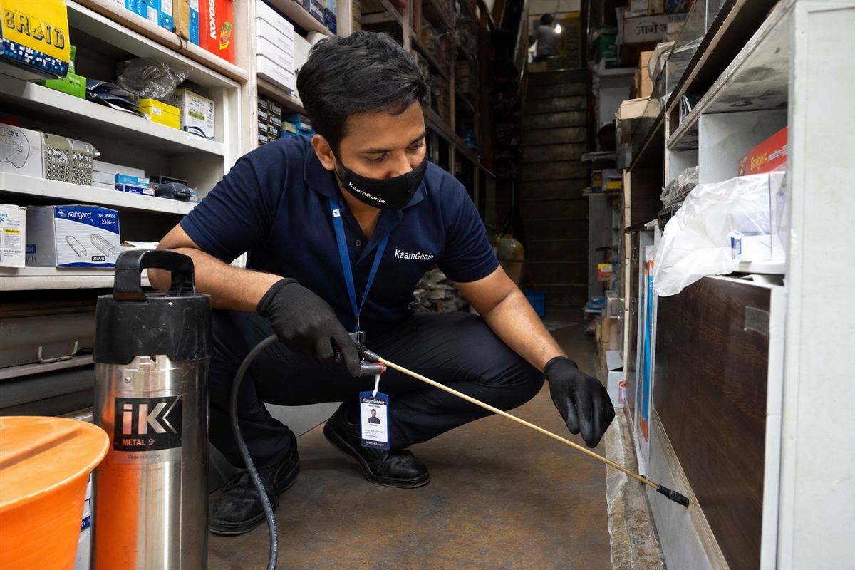 KaamGenie pest control technician treating a Chawri Bazar property in North Delhi / Central Delhi