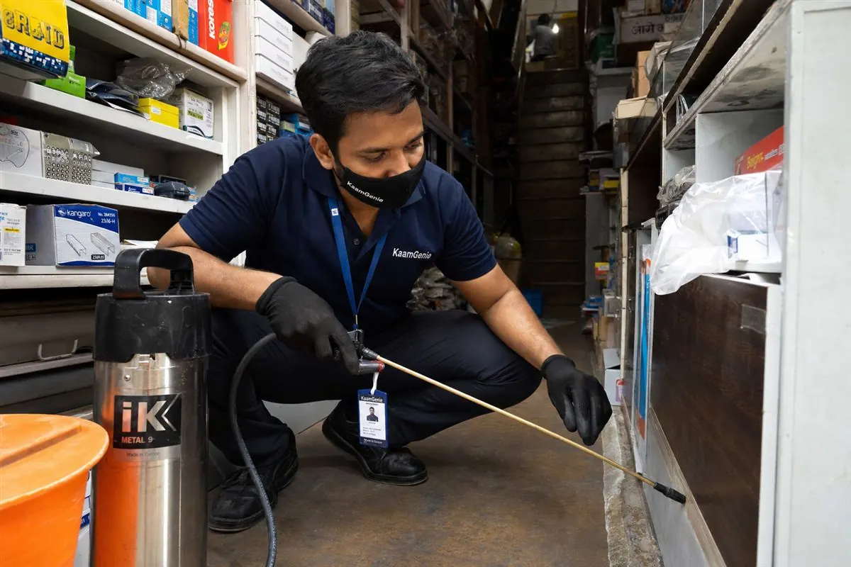 KaamGenie pest control technician treating a Chawri Bazar property in North Delhi / Central Delhi
