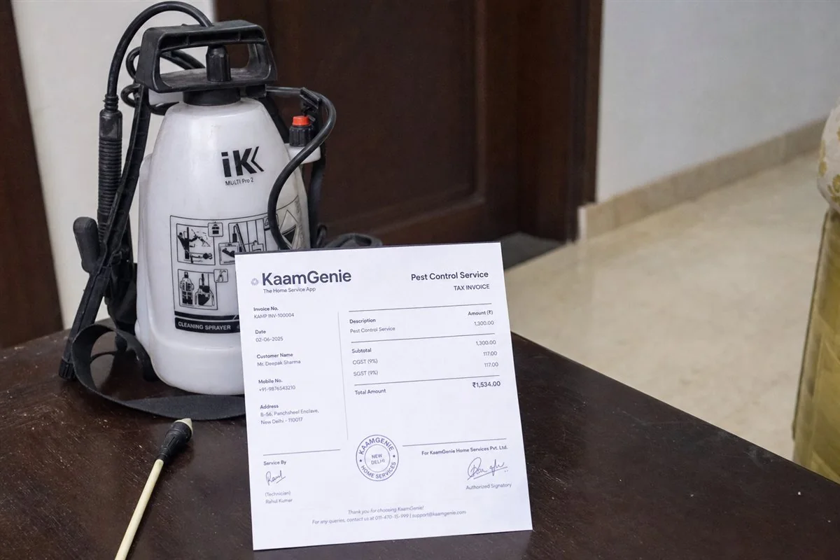 A clear itemised pest-control price quote being explained to a Delhi homeowner, showing treatment, area and GST line items