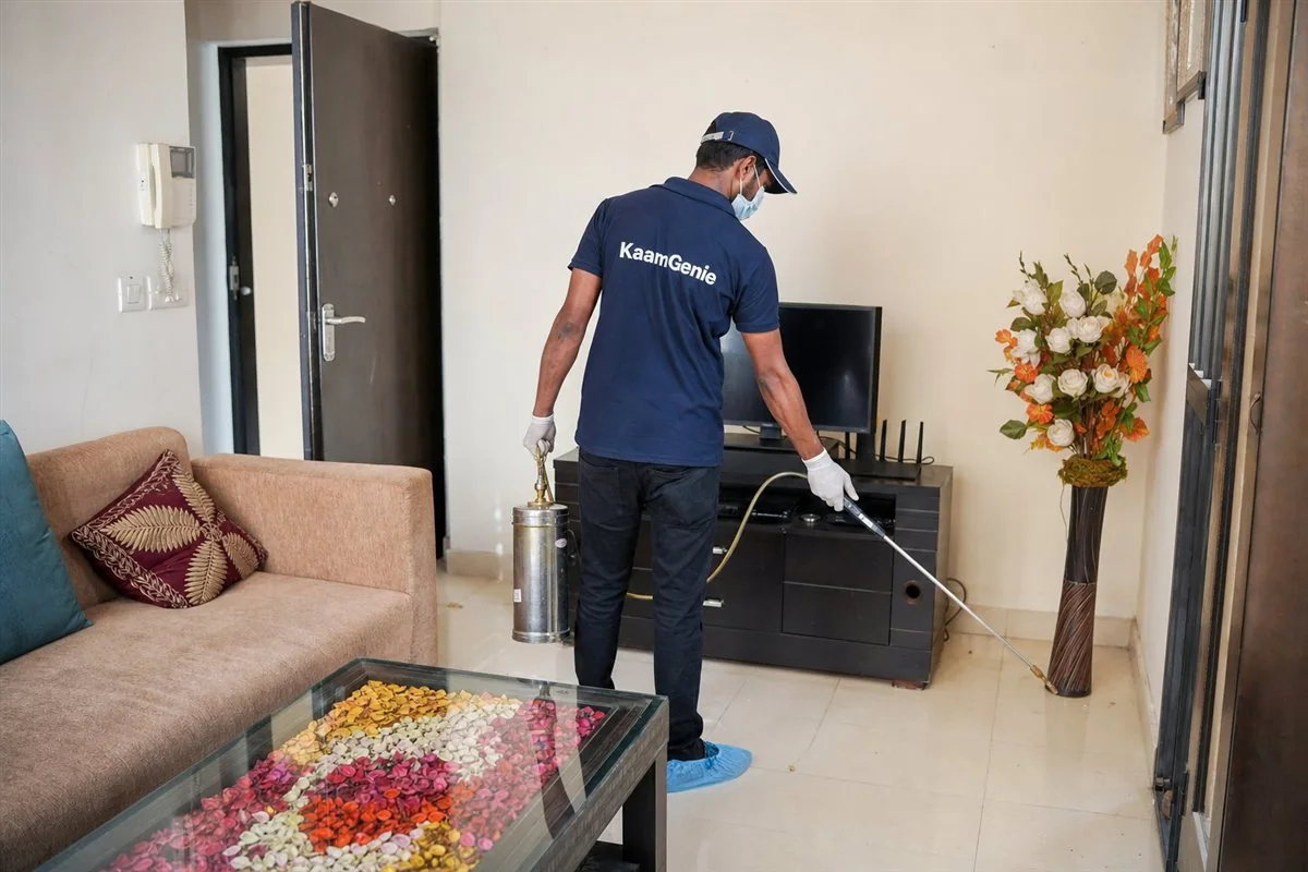 A Delhi tenant and landlord reviewing the maintenance clause of a rent agreement together at a table