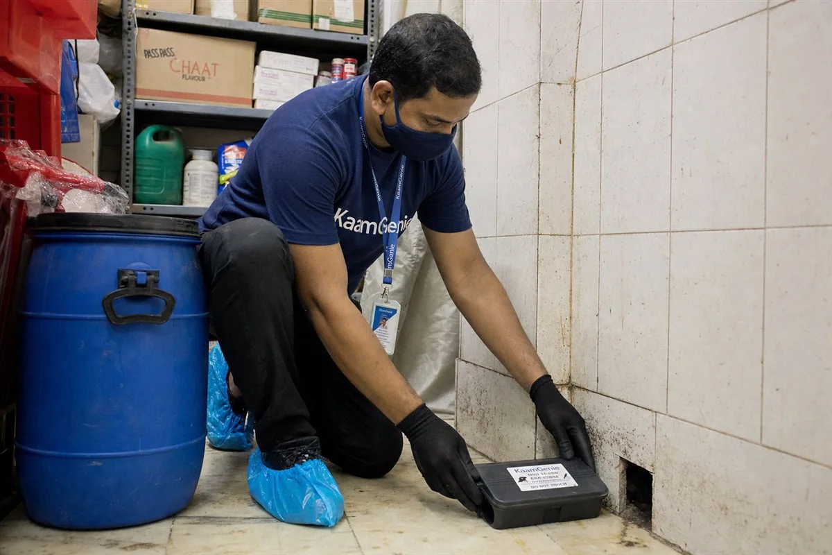 KaamGenie pest control technician treating a Dakshinpuri property in South Delhi