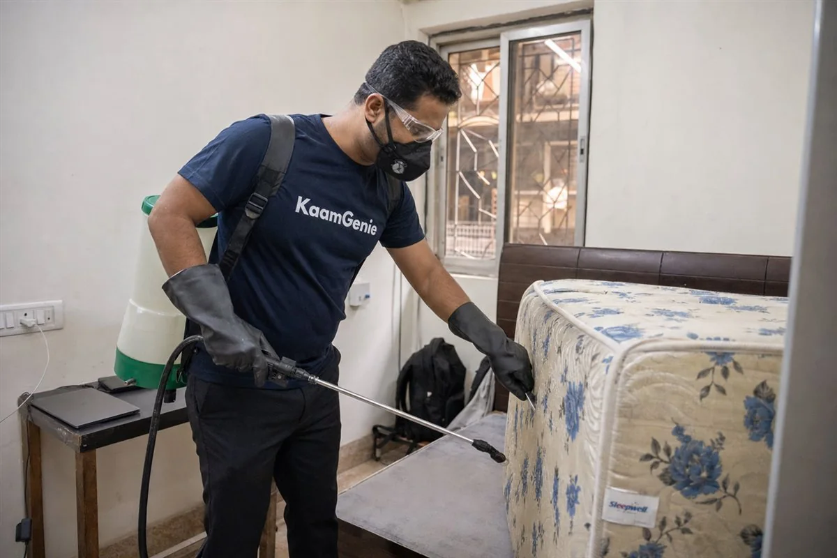 KaamGenie pest control technician treating a Daryaganj property in North & Central Delhi