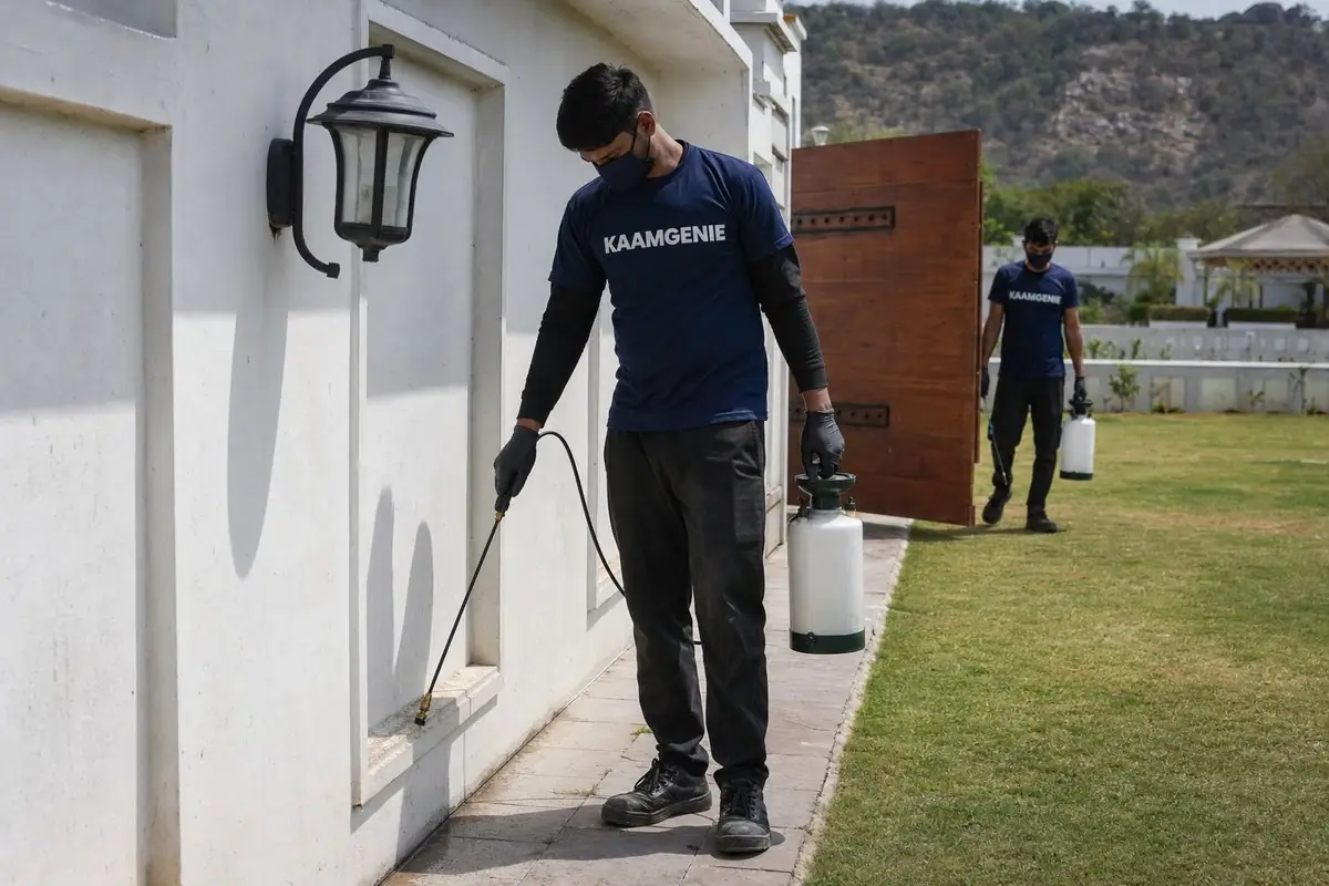 KaamGenie pest control technician treating a Dera Mandi property in South Delhi